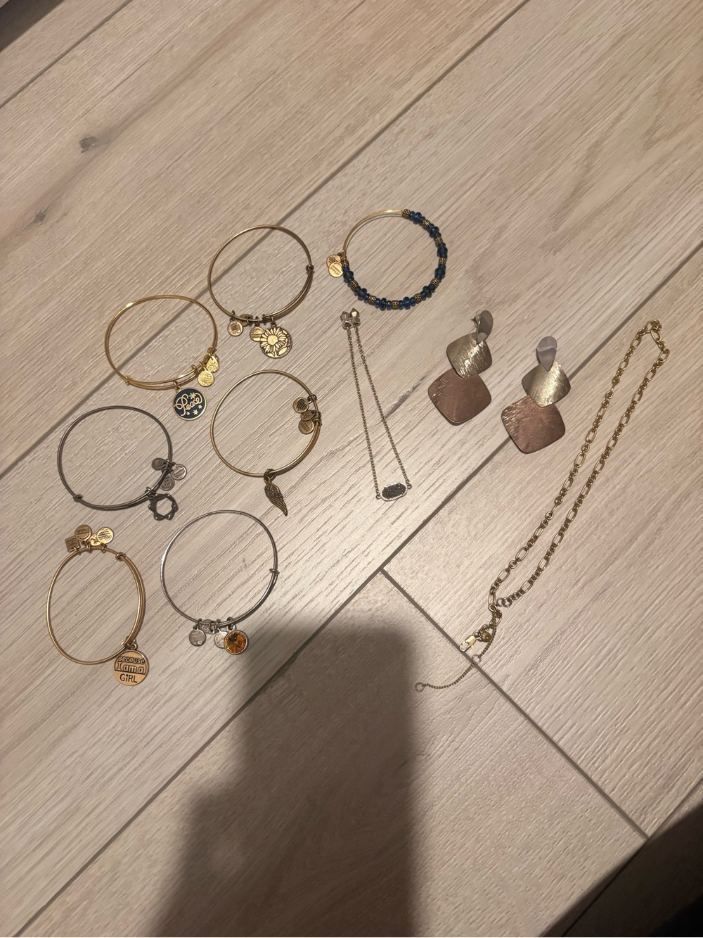 Kendra Scott + charm bracelets + gold necklace + mixed metal earrings